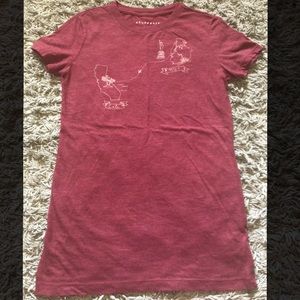 A maroon Aeropostale shirt with gold detailing 🌞.